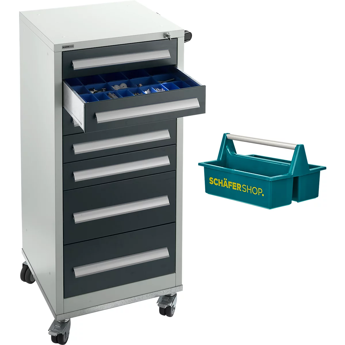 Chariot à outils avec tiroirs, un tiroir ouvert, à côté une boîte à outils verte avec poignée.