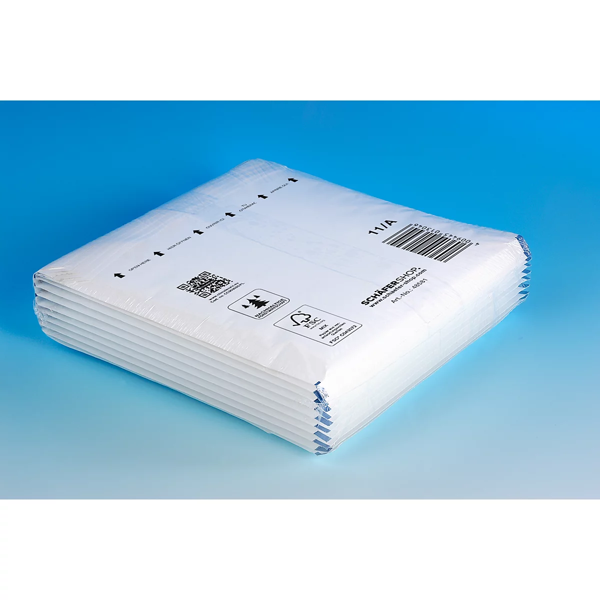 White, square package with barcode, arrows and logos on a blue background.