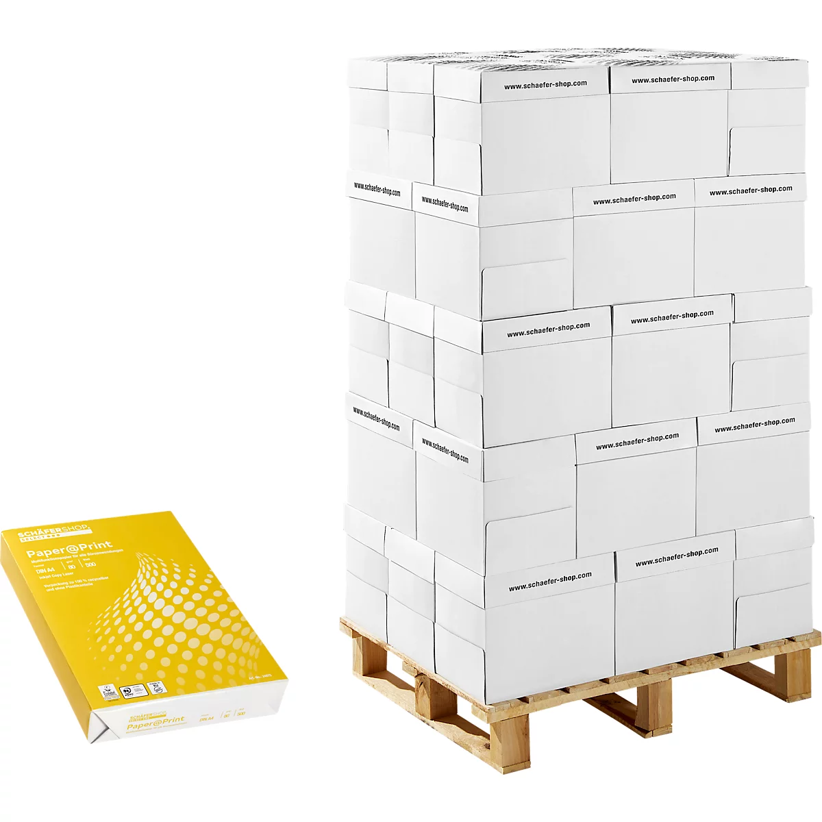 A stack of white boxes on a wooden pallet and a yellow stack of paper next to it. The boxes are printed with 'www.schalter-shop.com'.