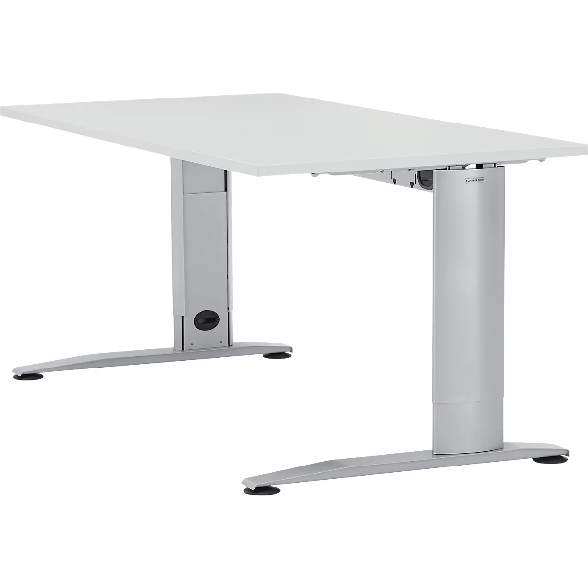 Desk with white tabletop and silver height-adjustable legs.