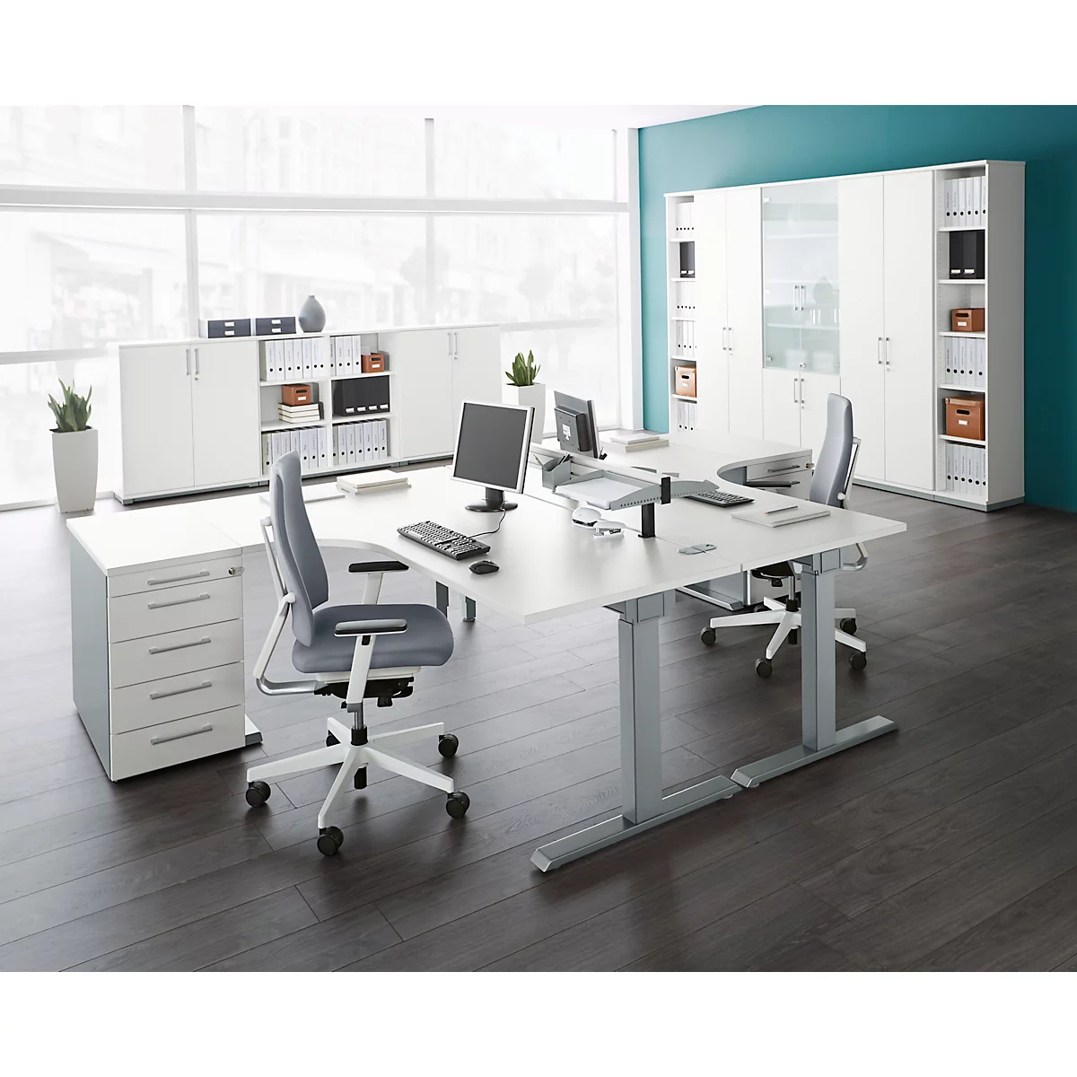 Office with desks, chairs, and cabinets in white and grey.