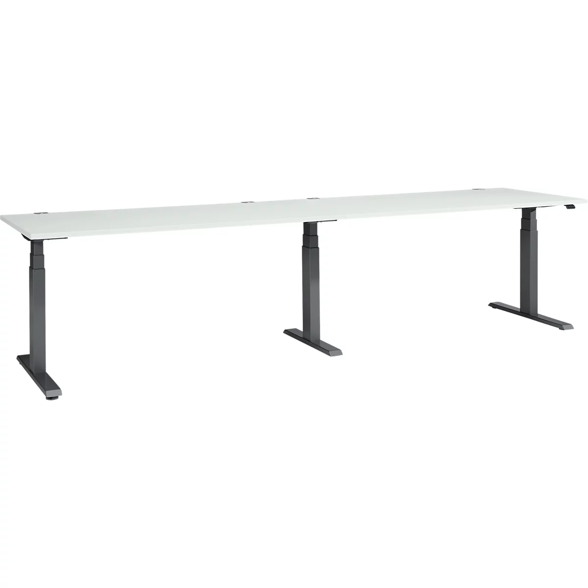 Long white desk with height-adjustable dark legs.