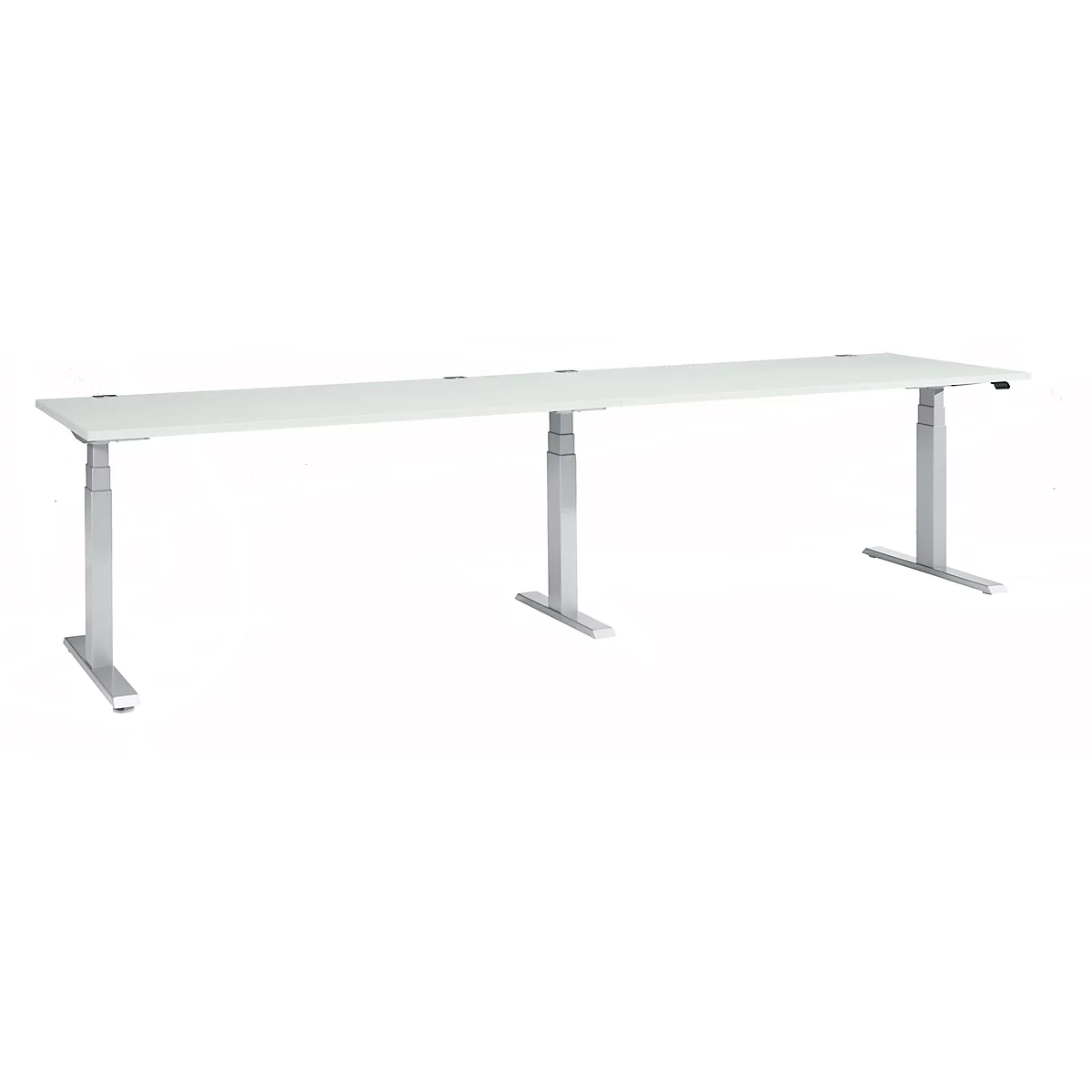 A white, elongated desk with adjustable silver legs. On a light background.