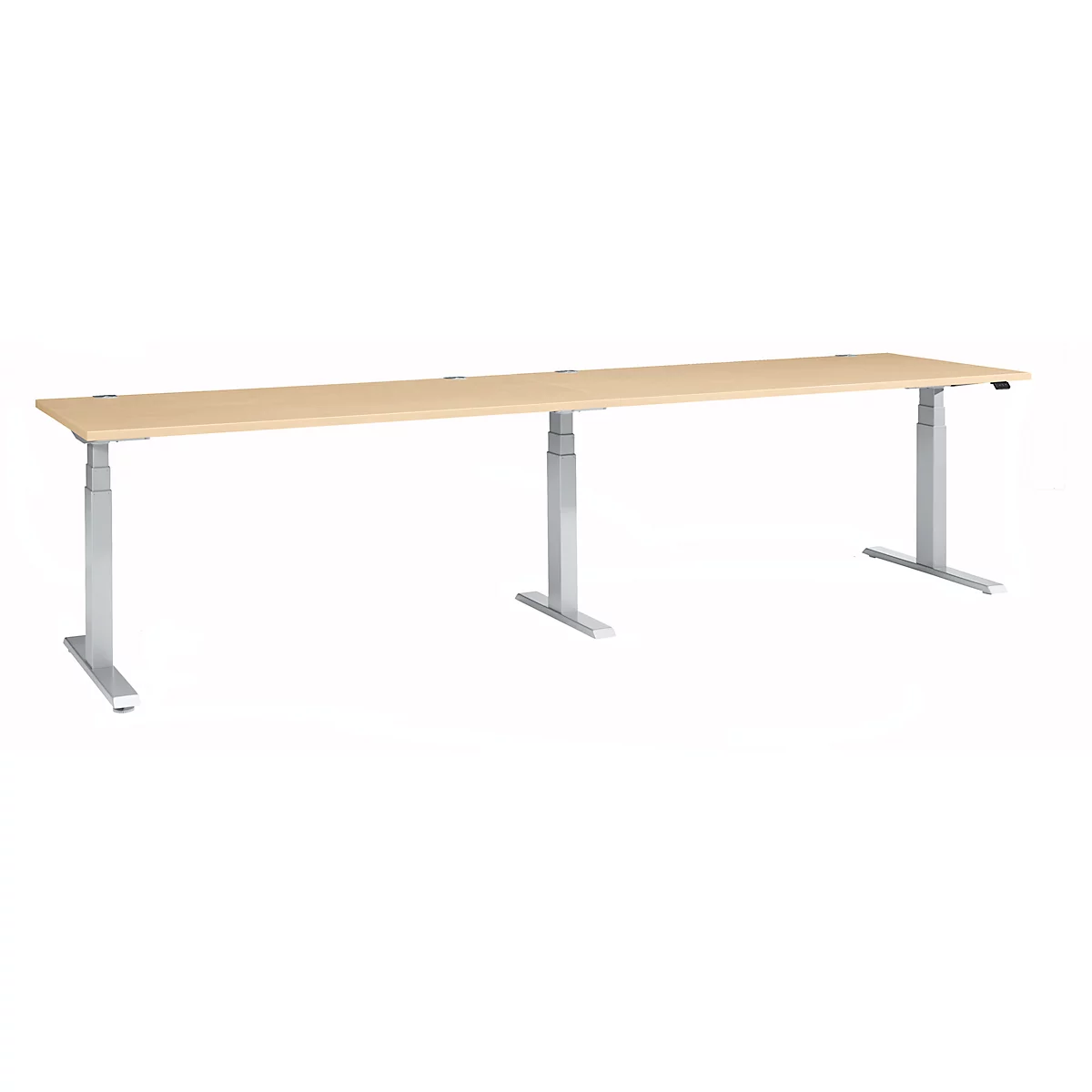 A long, height-adjustable desk with a light wood top and silver legs.