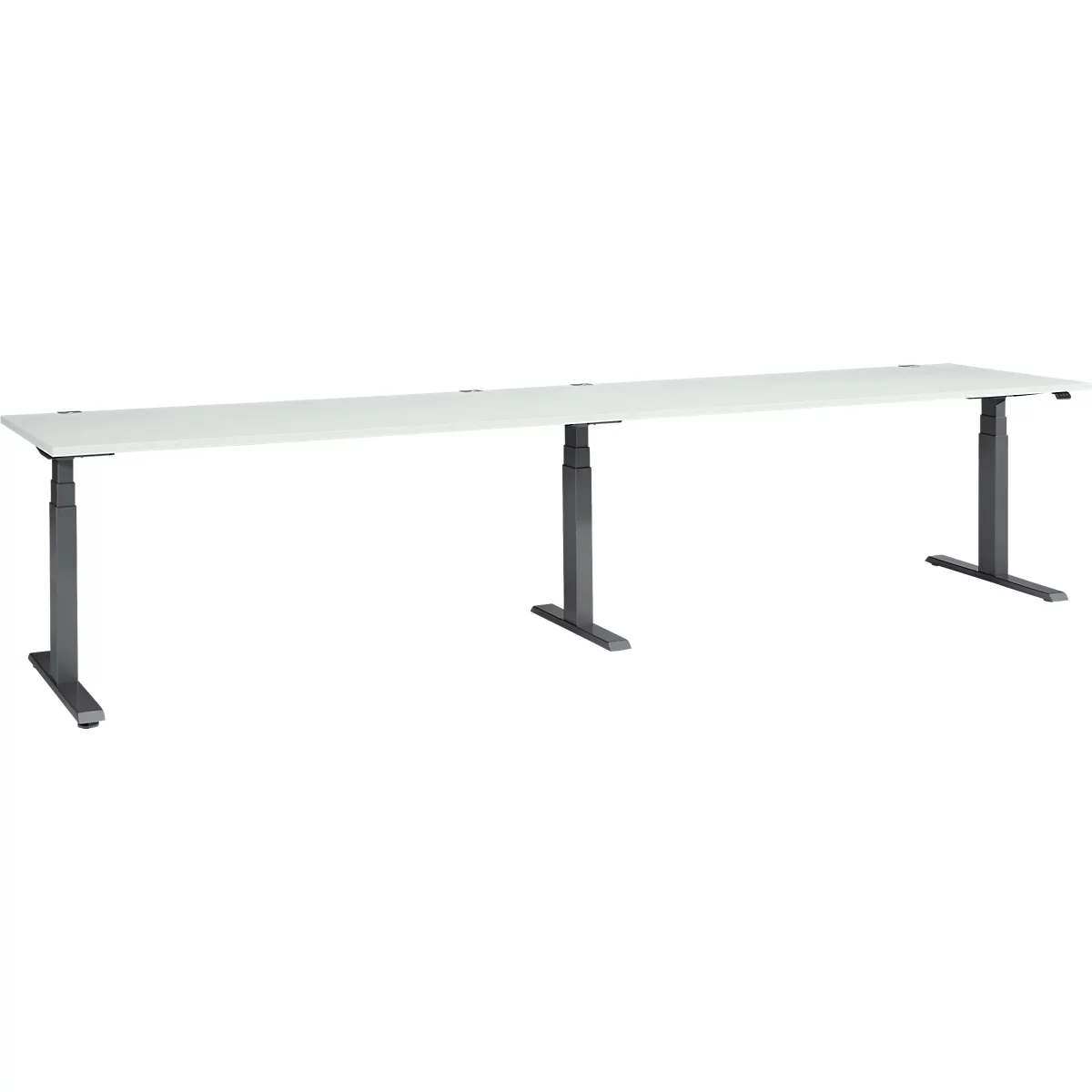 A long, white desk with three dark, height-adjustable legs, in front of a white background.