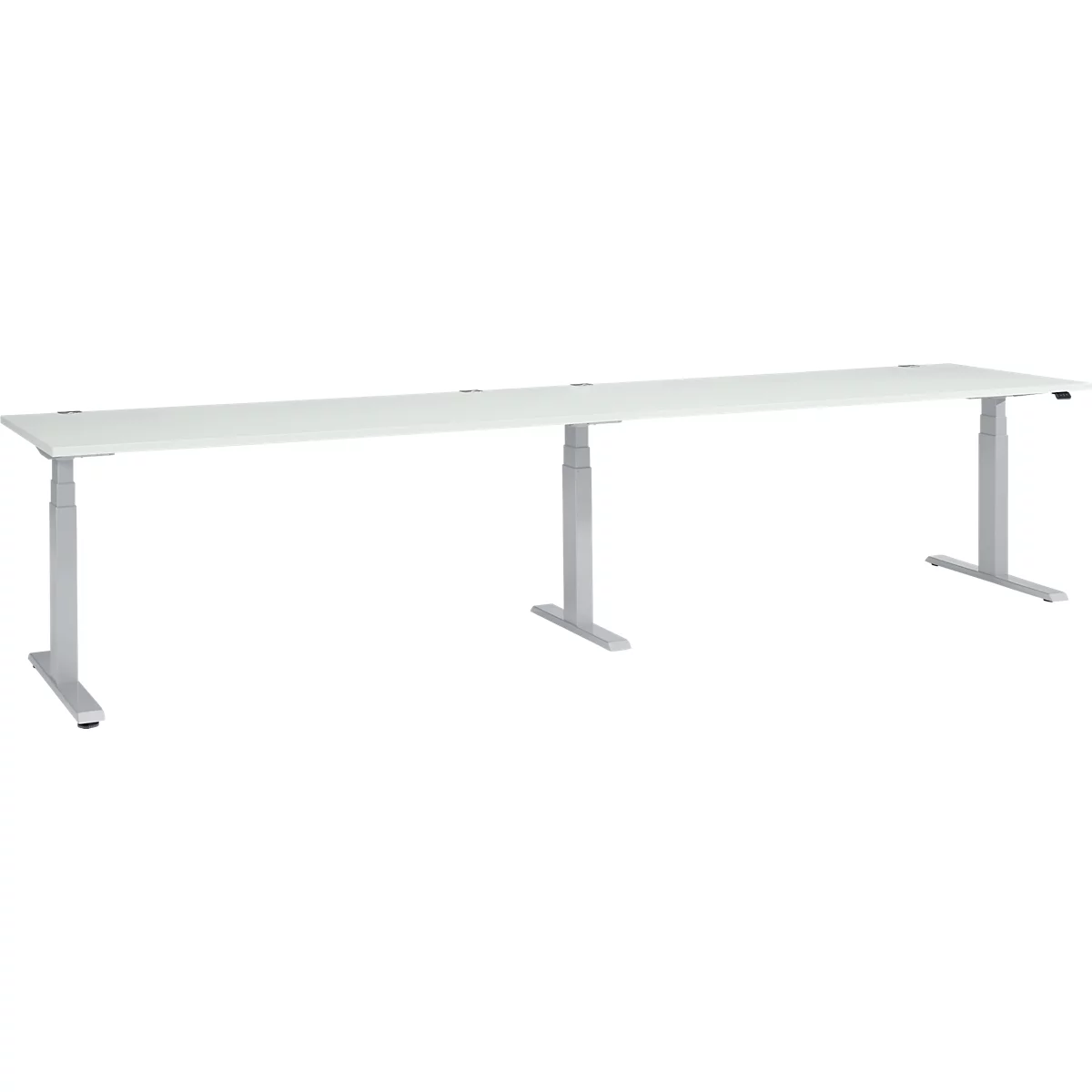 A long, white desk with height-adjustable, silver legs.