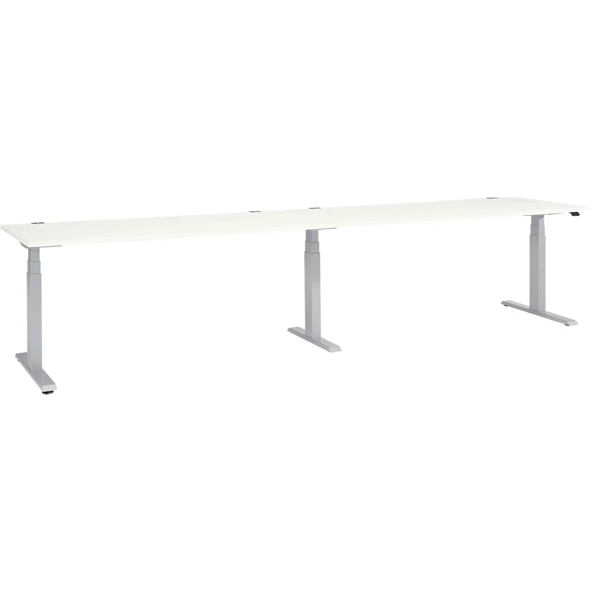 A long, white desk with silver height-adjustable legs, set against a white background.
