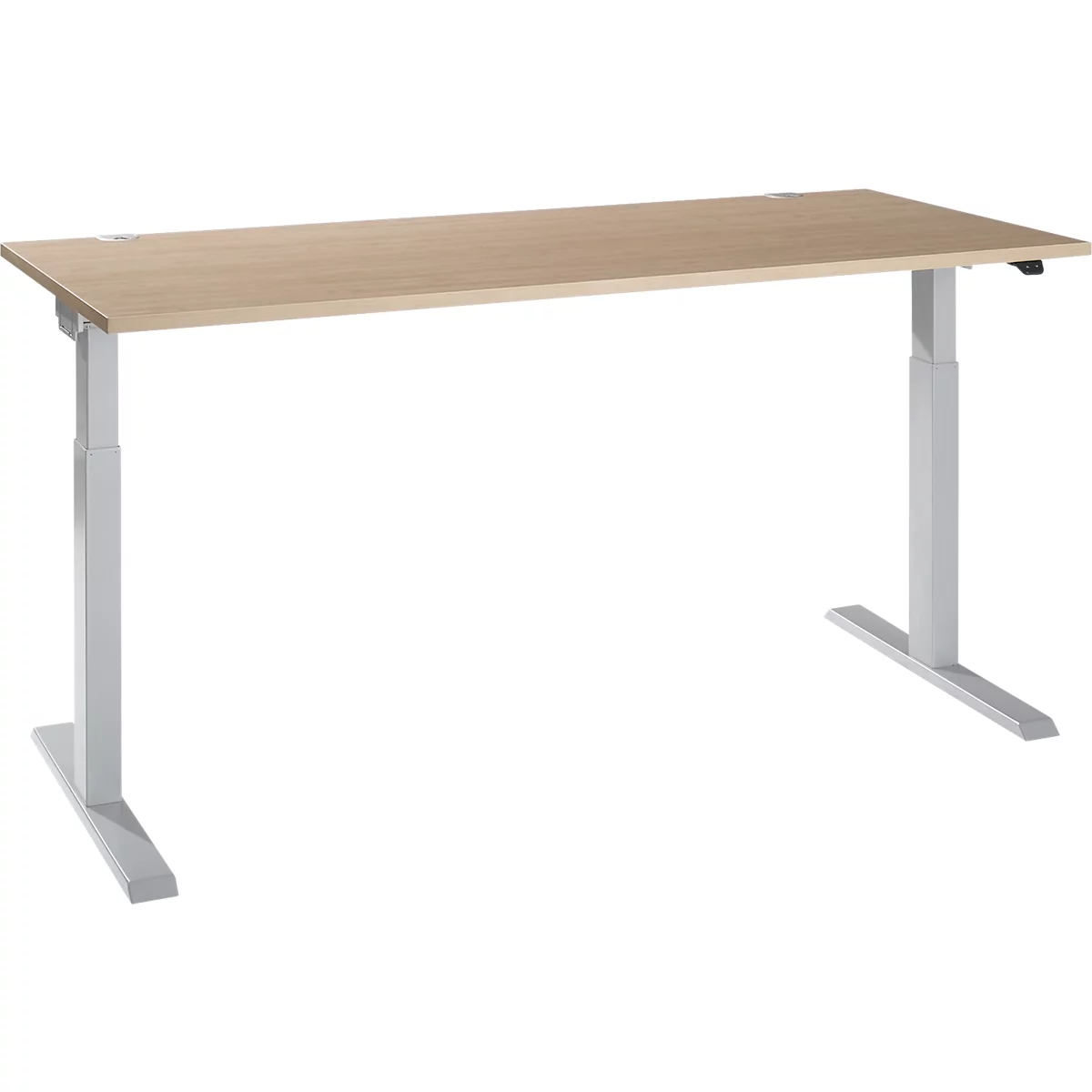 An adjustable-height desk with a light wood top and silver legs, set against a white backdrop.