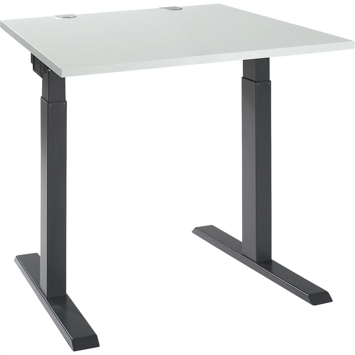 Desk with white table top and gray height-adjustable frame, photographed slightly from the side.