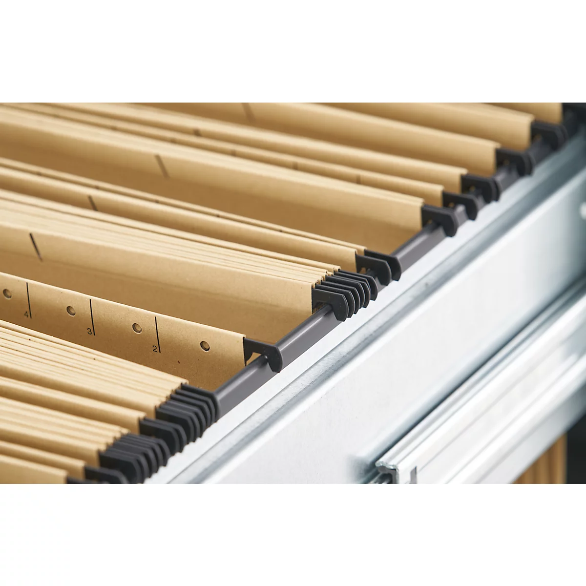Close-up of hanging file folders in a file cabinet. The files are light brown and neatly arranged.