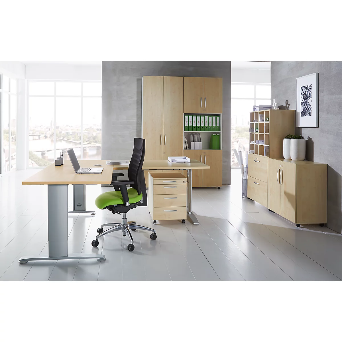 Office with desk, chair, filing cabinets. Laptop on the desk.