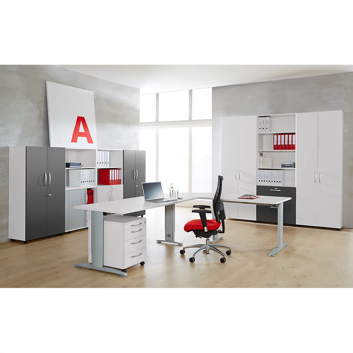 Office with furniture: desk, wall unit, swivel chair. Red "A" on white picture, windows in the background.