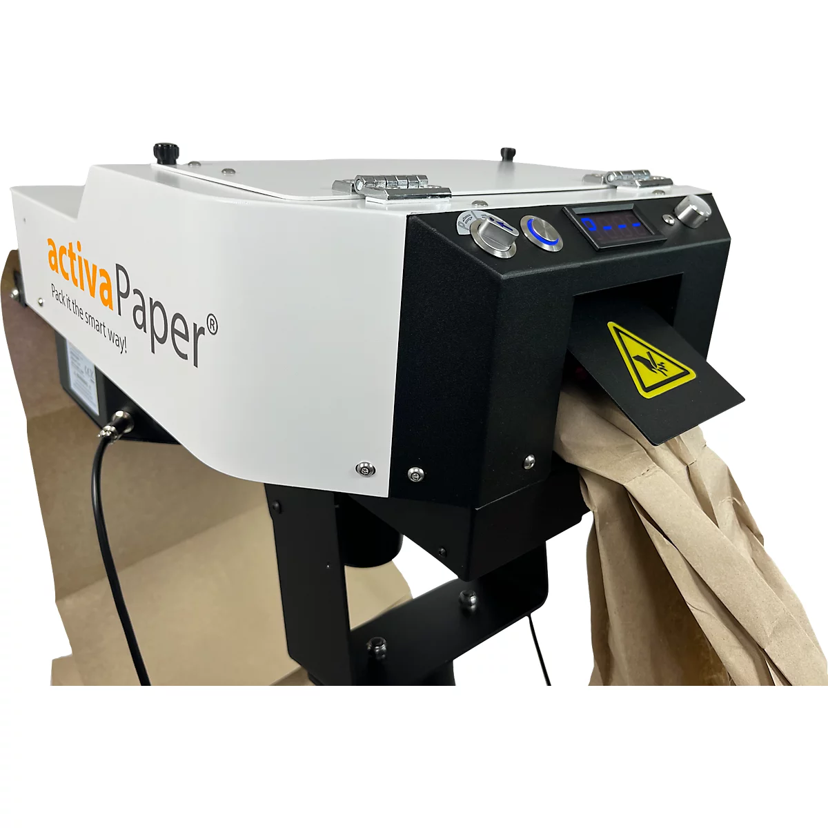 Machine de traitement du papier avec inscription 'activaPaper', distribuant du papier dans un sac.