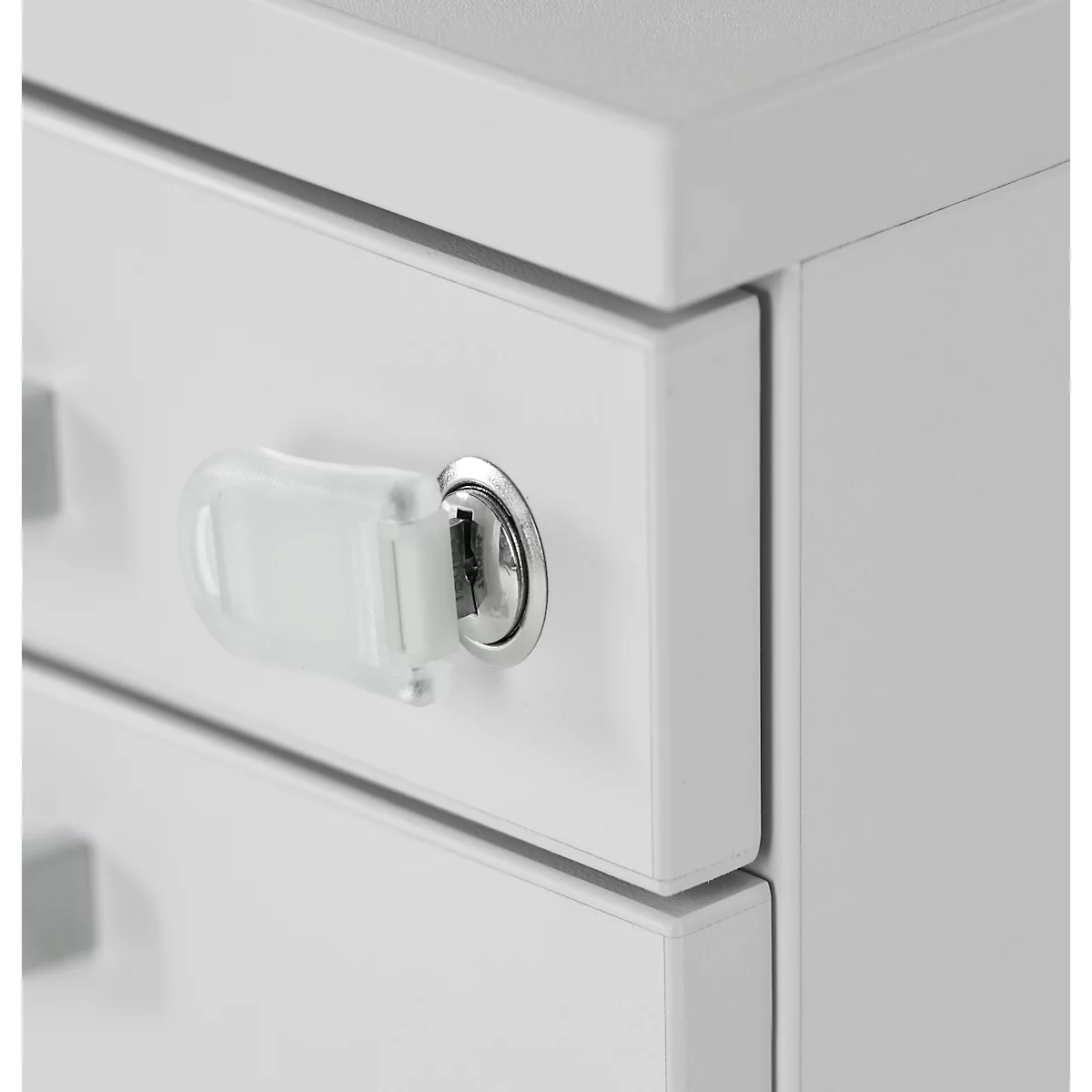 Close-up of a white cabinet with lock and key. A transparent key is in the lock.