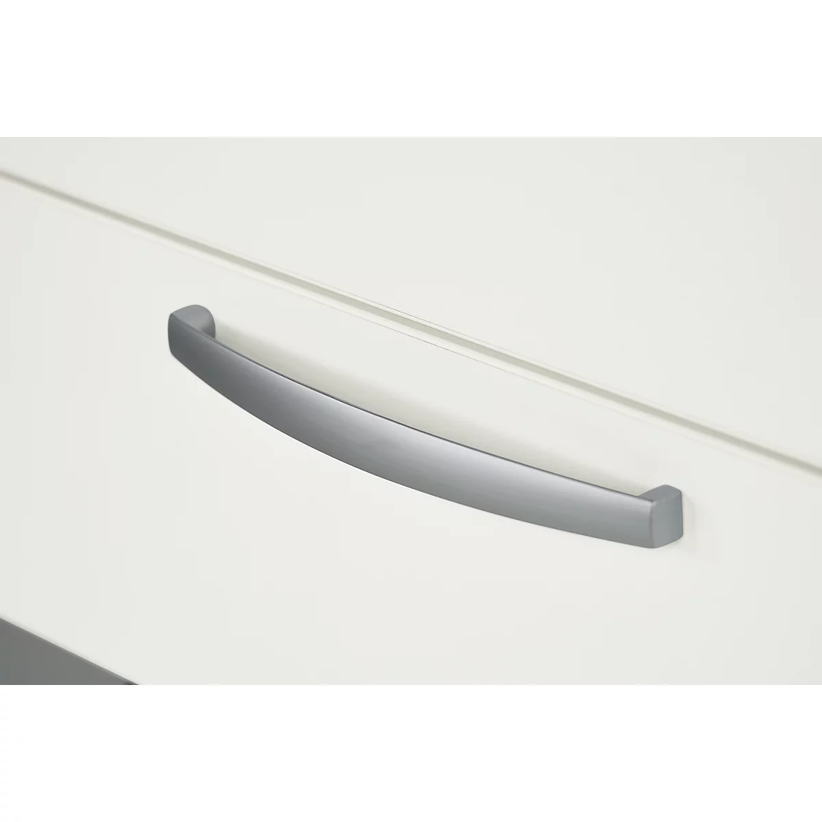 Gray, curved handle bar on white surface.