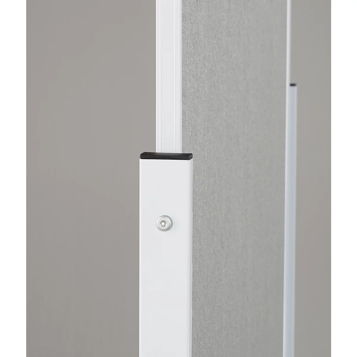 Close-up of a white office partition with gray fabric element and details such as a small, silver screw.