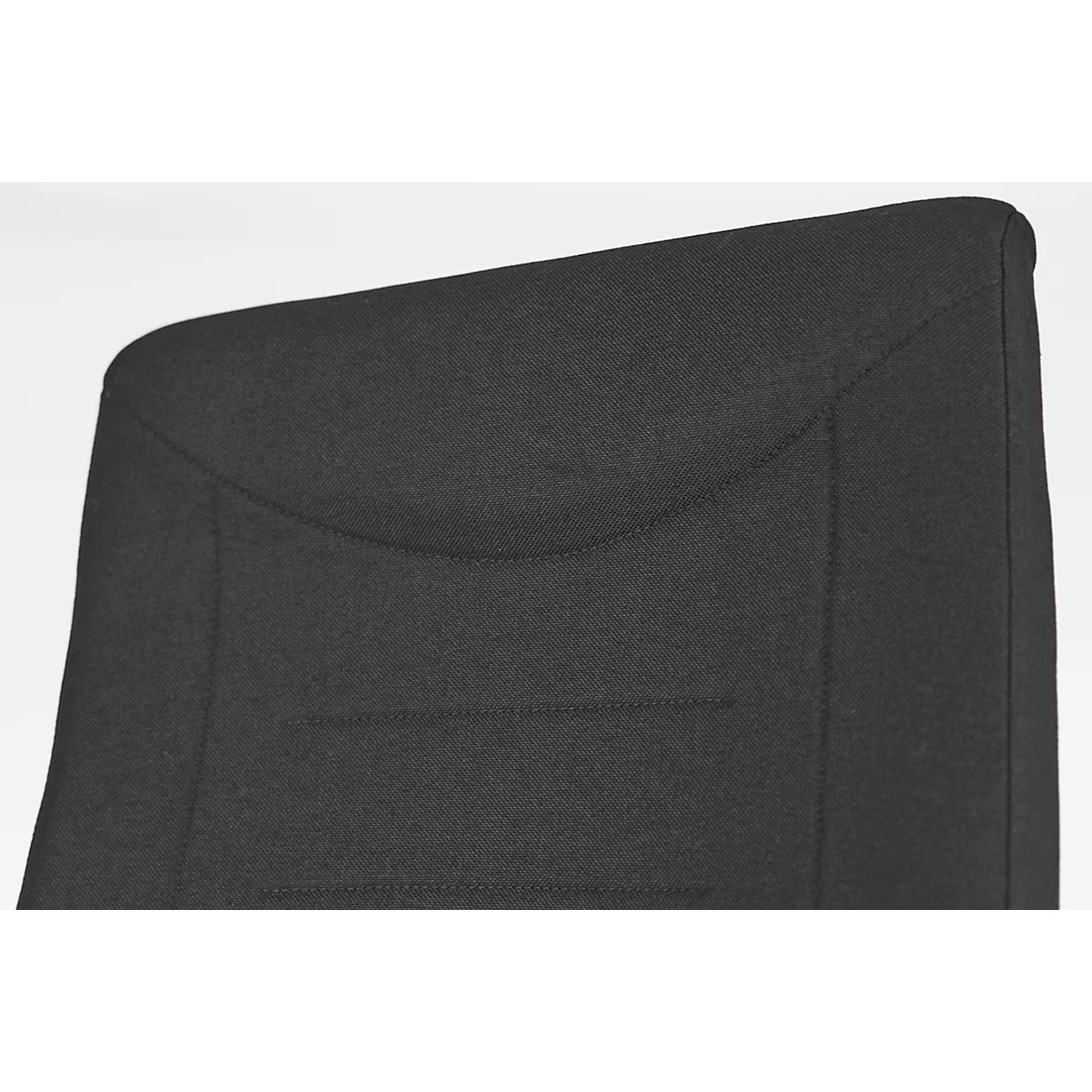 Close-up of a black chair's padded backrest. The shape is rounded, with careful stitching.