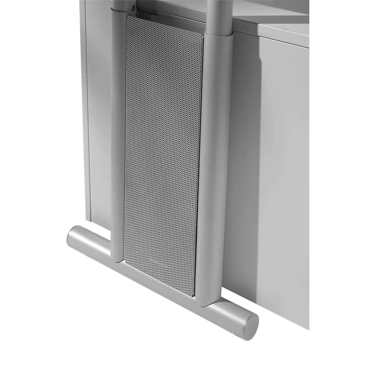 Close-up of a grey, rectangular structure attached to a piece of furniture. It features a perforated design, framed by a metal structure.