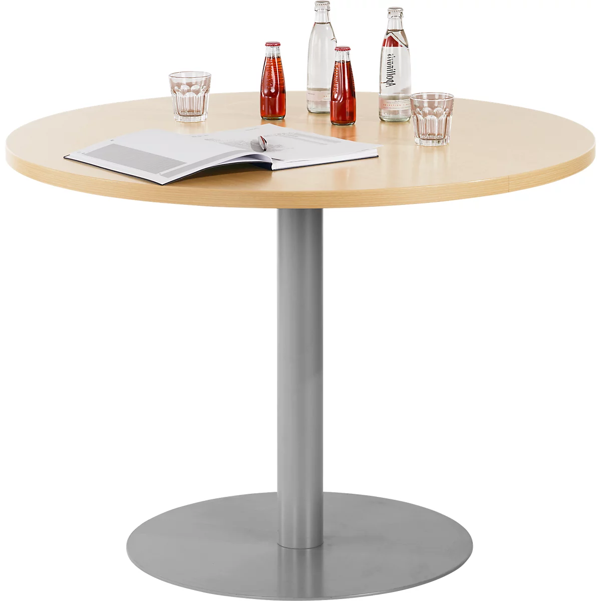 Round wooden table with drinks, magazine, grey leg and stand.