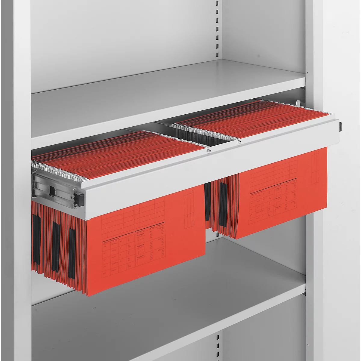 Open white filing cabinet with red hanging files.