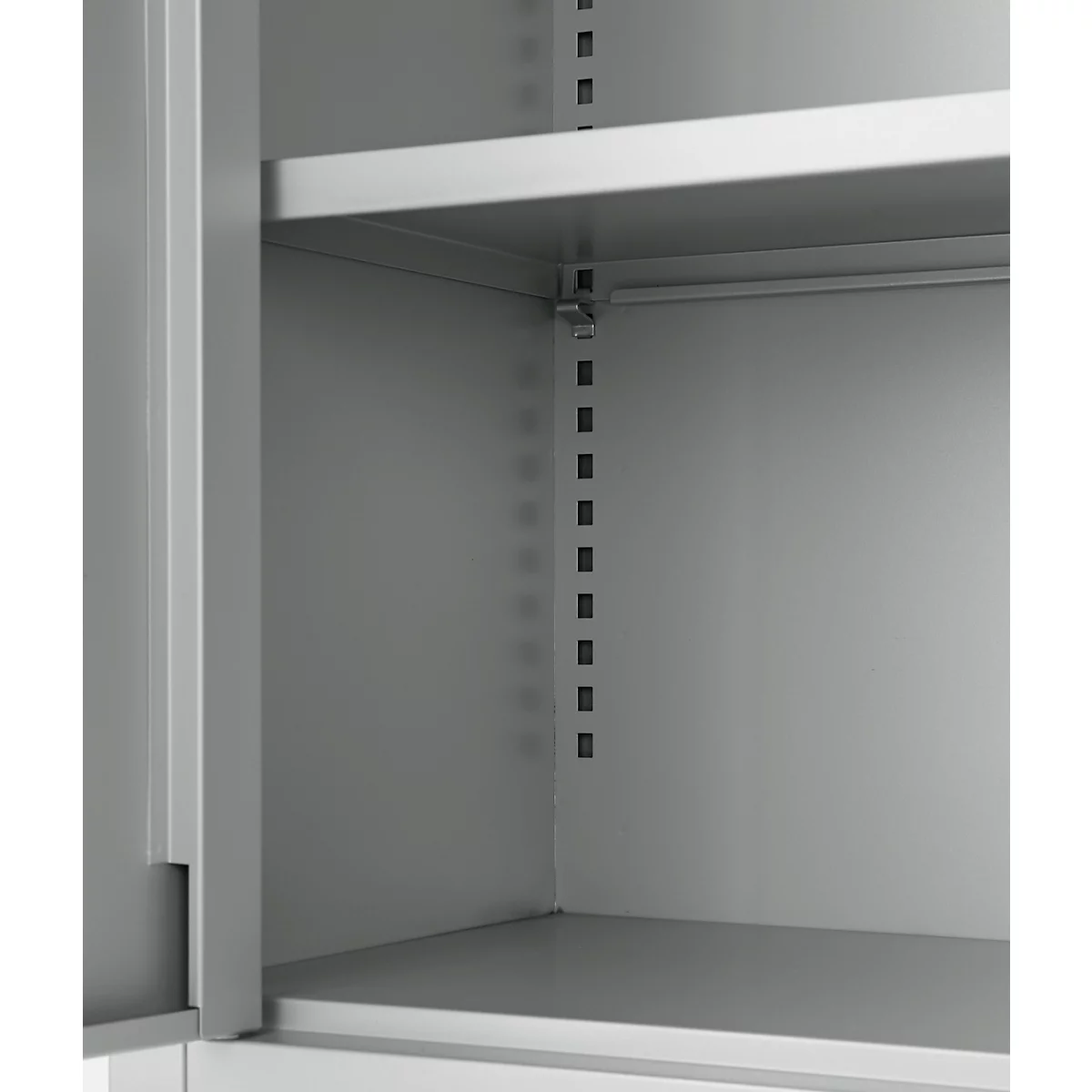 View into a gray metal cabinet, with shelf and shelf supports.