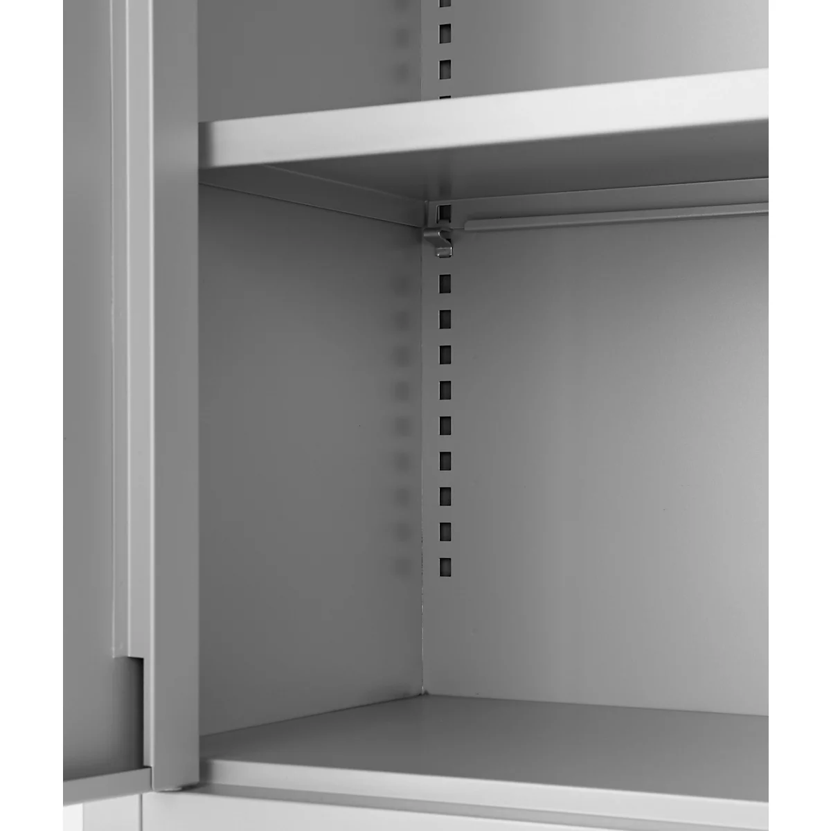 Grey cabinet interior with shelves and brackets, detail shot.