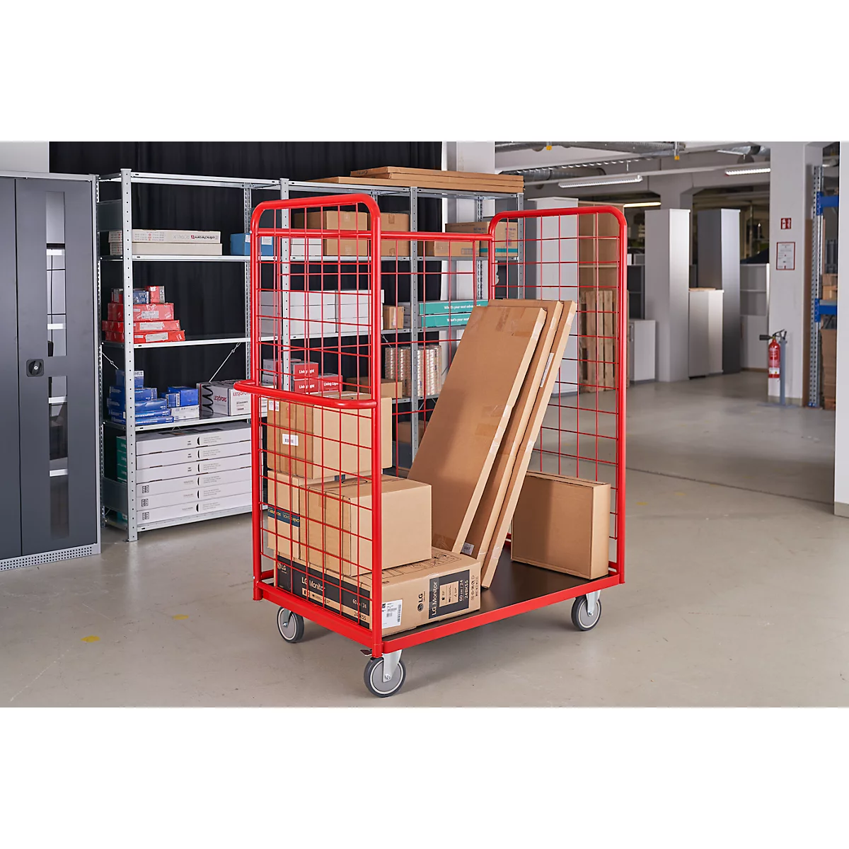 Red transport cart loaded with goods in a warehouse.
