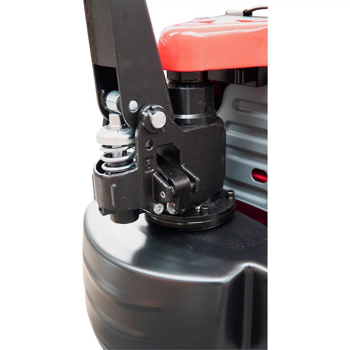 Detailaufnahme einer schwarzen, mechanischen Hebevorrichtung. Teile aus Metall und rotem Kunststoff.