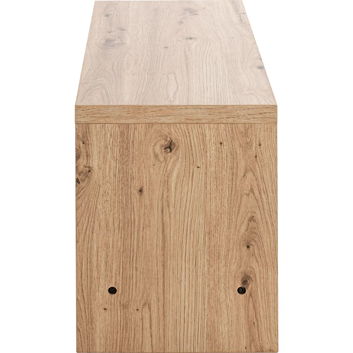 Nahaufnahme einer Holzkommode mit Maserung und sichtbaren Astlöchern.