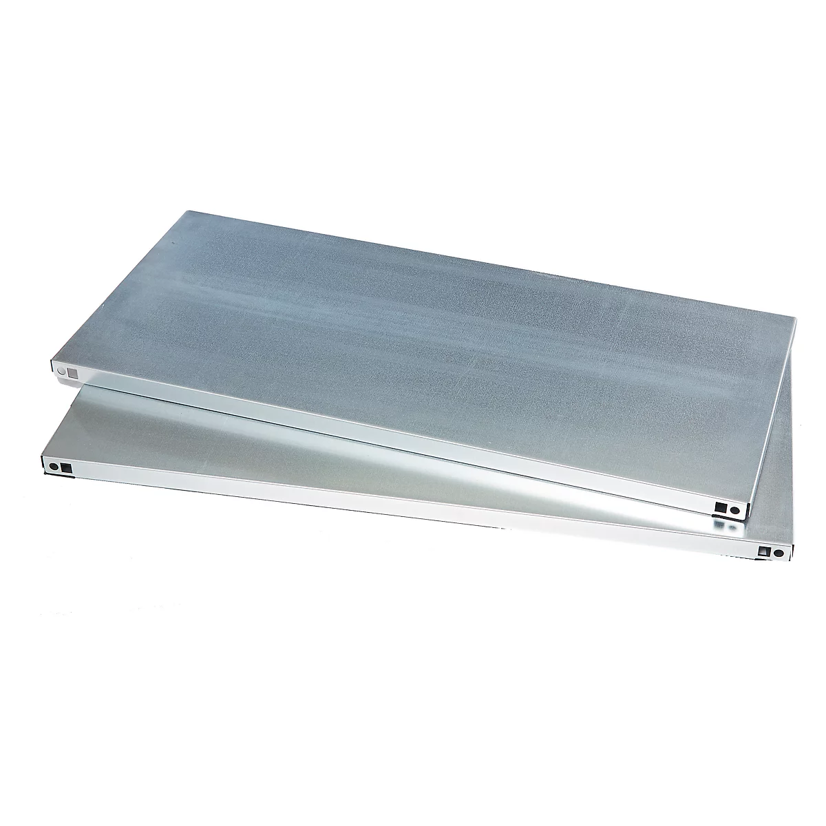 Two silver metal plates lying on top of each other. The top plate is slightly offset.