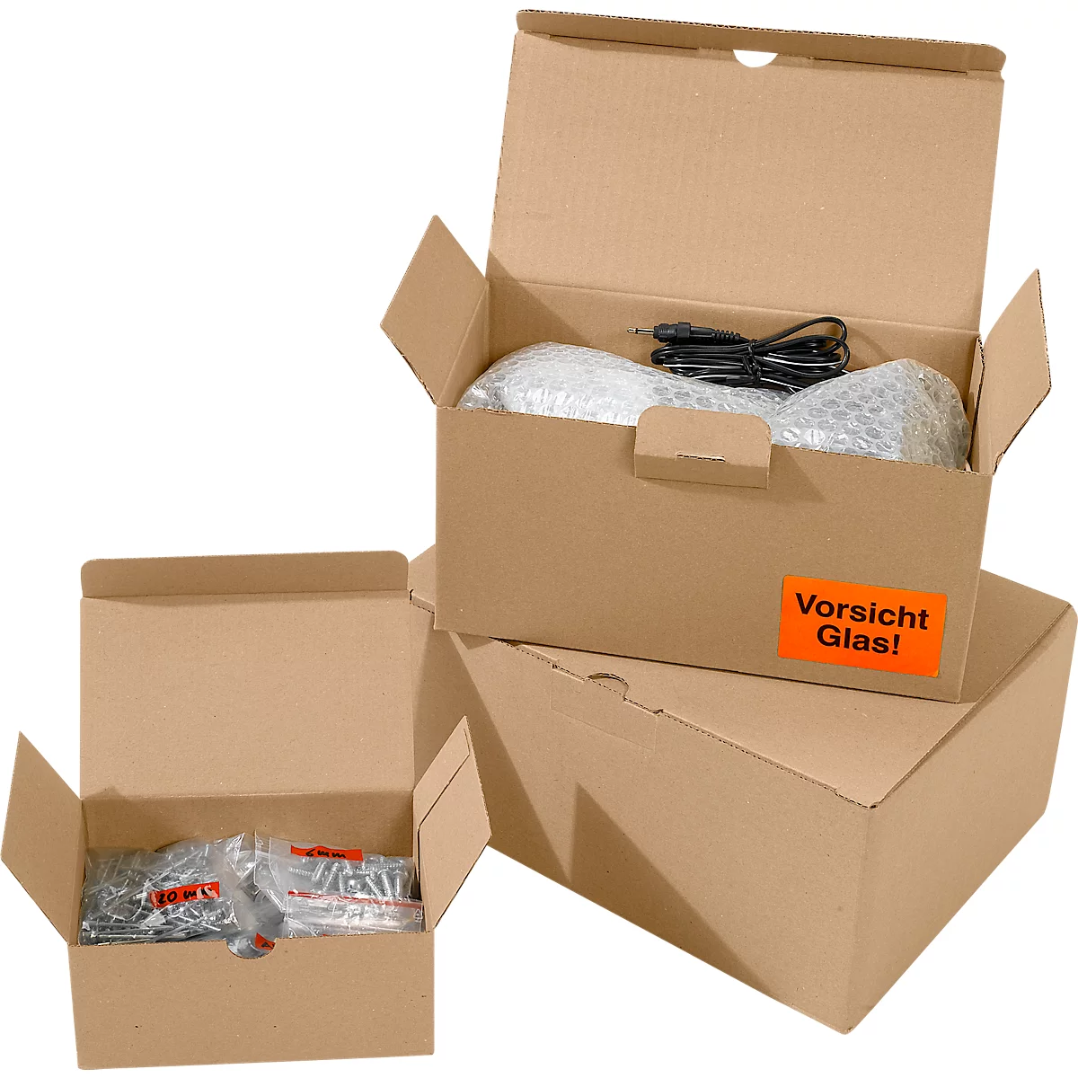 Opened cardboard boxes with packaging material and contents. One box has a sticker that says 'Caution Glass!'