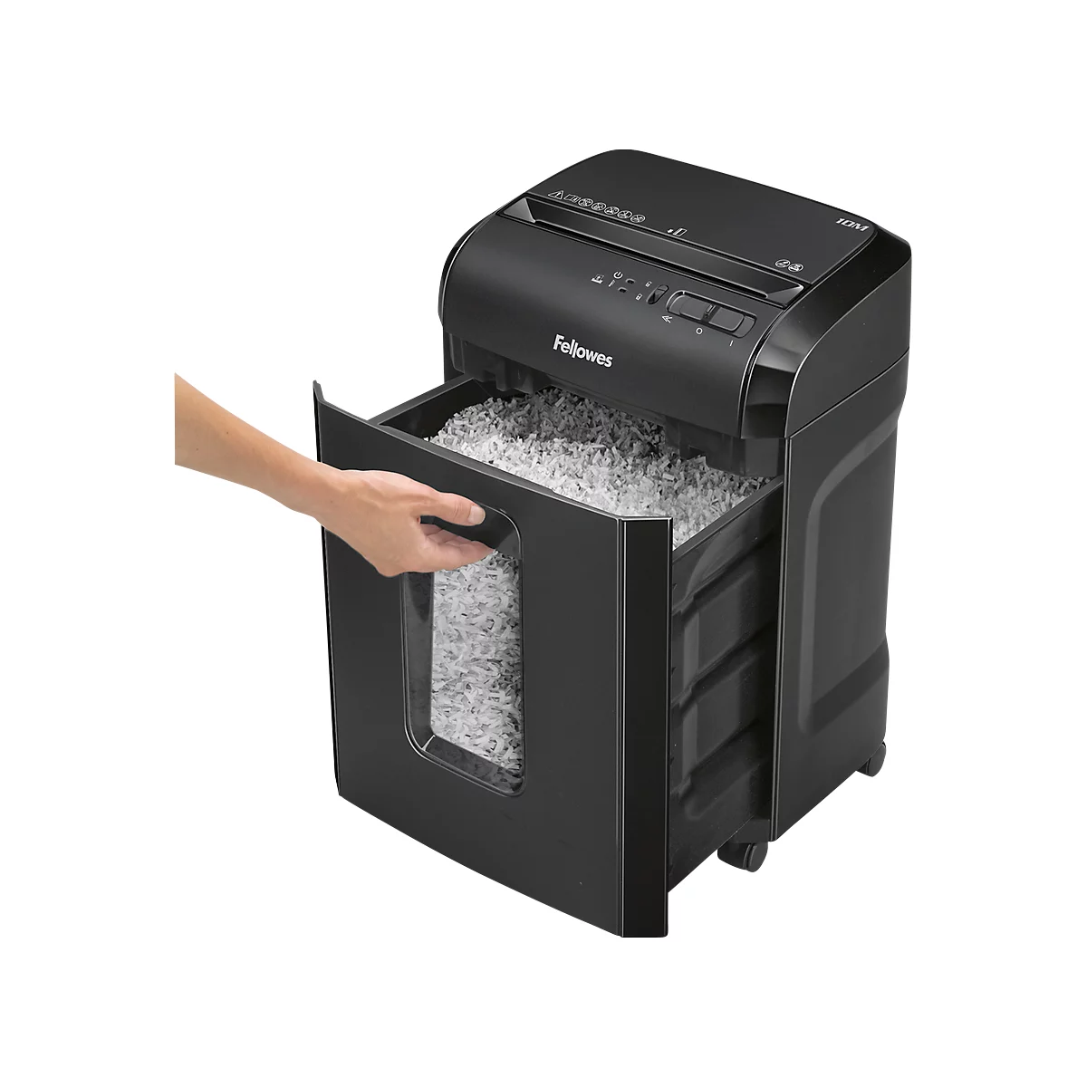 A black paper shredder with its drawer being opened, showing the shredded paper. A hand is holding the handle.