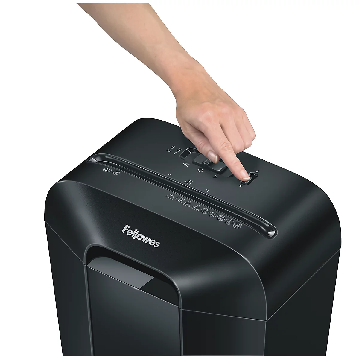 Person presses a button on a paper shredder. Black shredder with white Fellowes lettering.