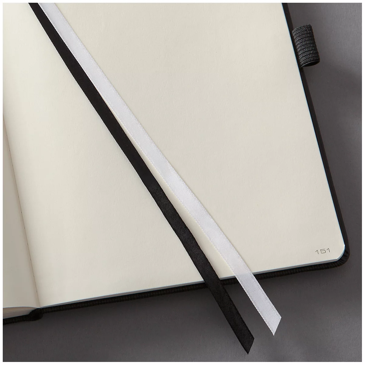 Open notebook with two bookmarks: black and white. The page number 151 is visible.