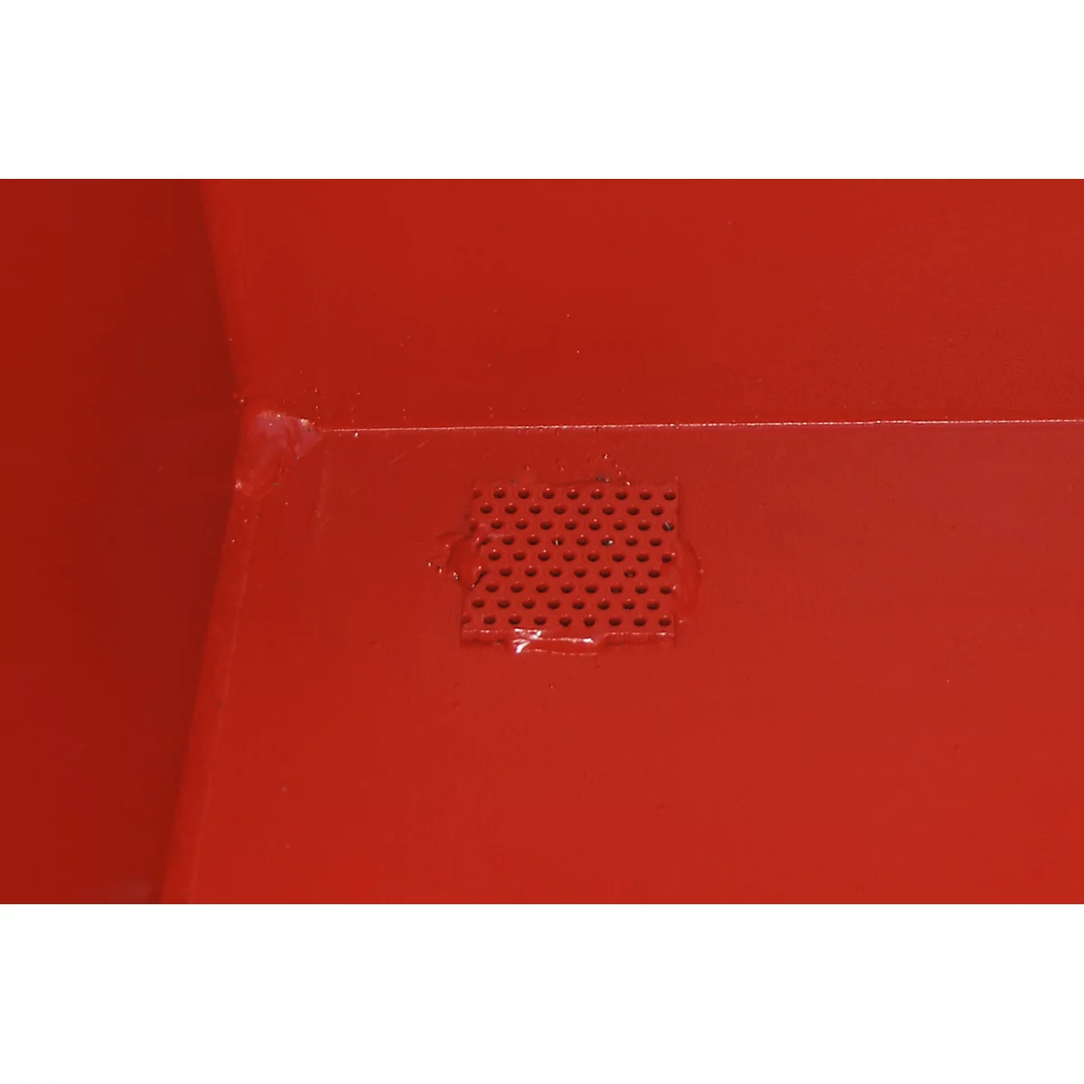 Red detail. Rectangle with many small holes.