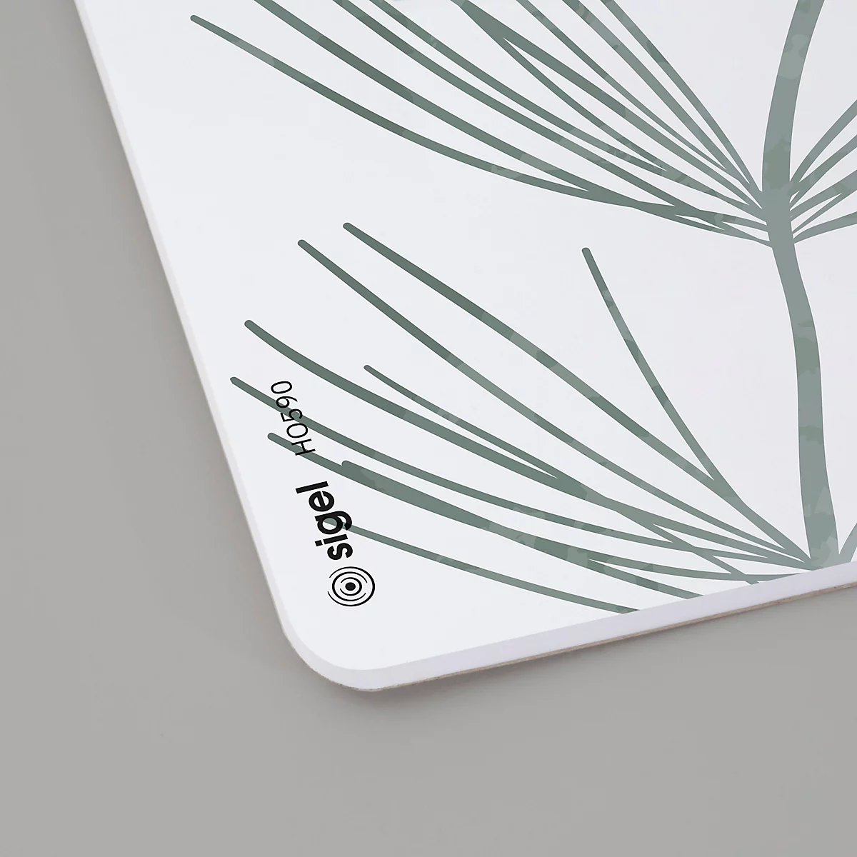 Bloc-notes rectangulaire blanc avec motif de feuilles grises. Bordé par 'sigel HO890'.