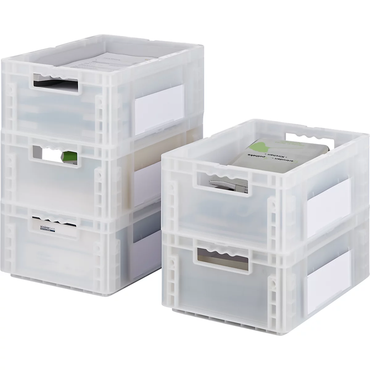 Deux boîtes en plastique transparentes et empilables remplies de papier et de livres.