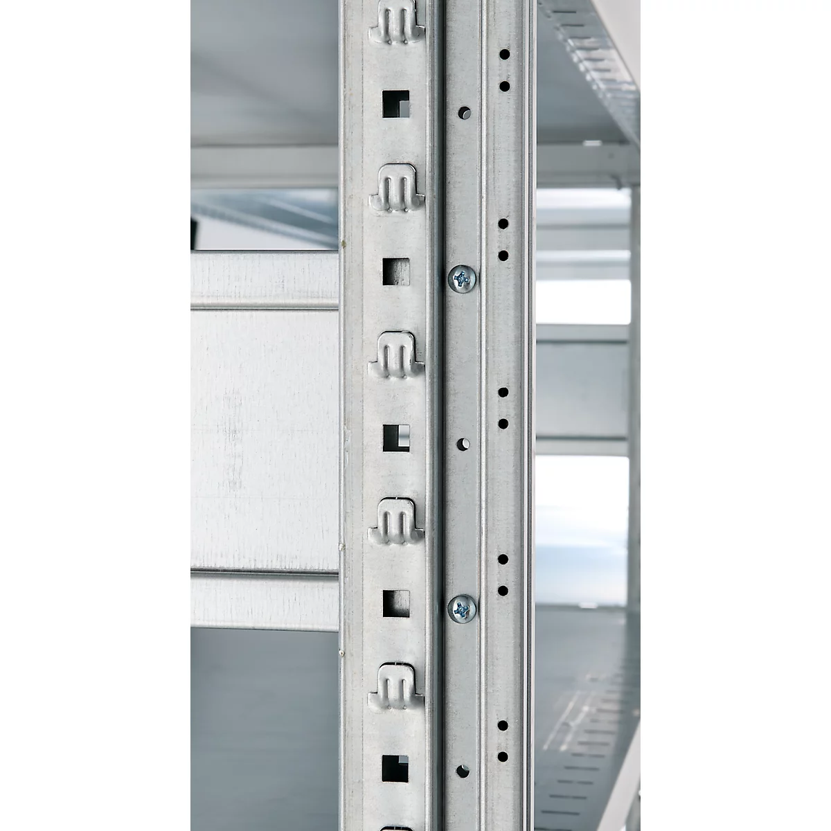 Close-up of a metal shelf support with square openings and screws.