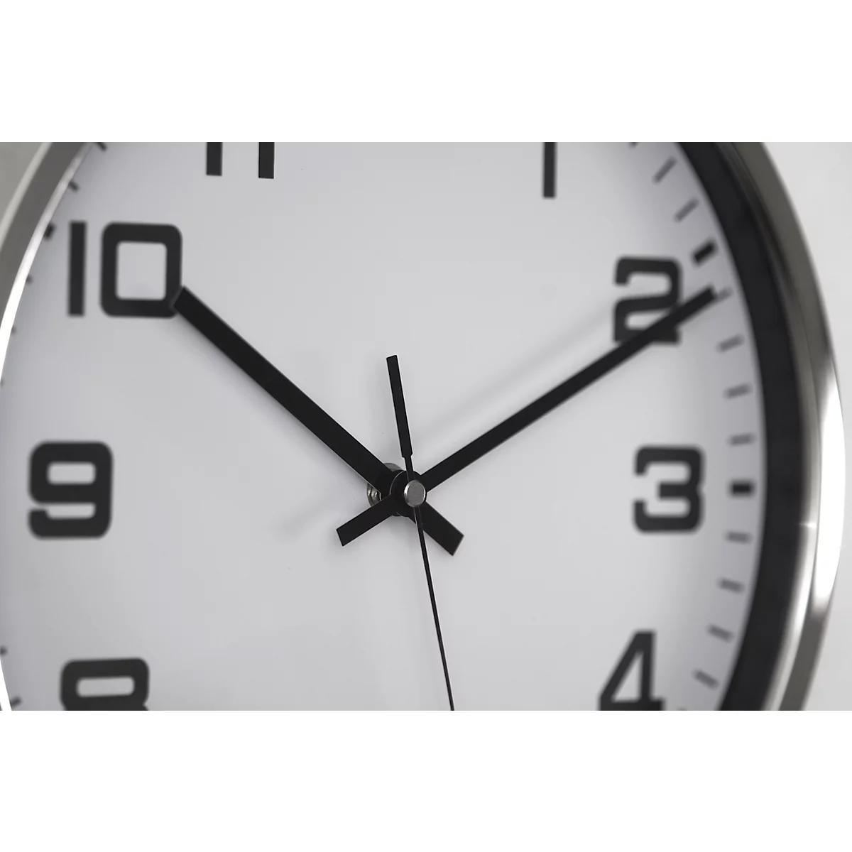 Close-up of a clock showing just before ten o'clock.