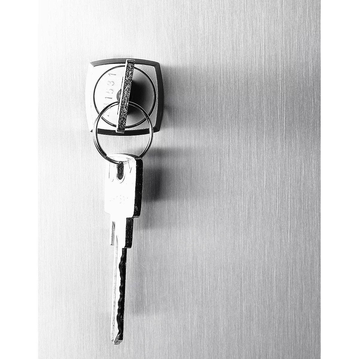 Keys in a lock. A key ring is hanging down. Grey background with vertical lines.