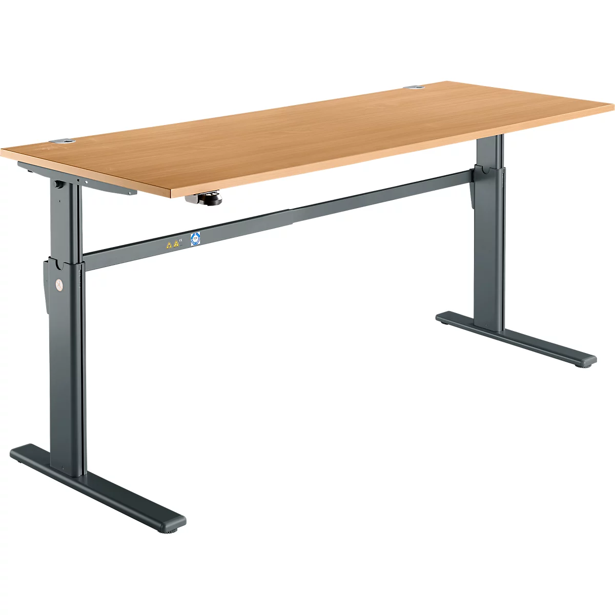 An adjustable-height desk with a light brown tabletop and gray metal legs. The height can be adjusted.