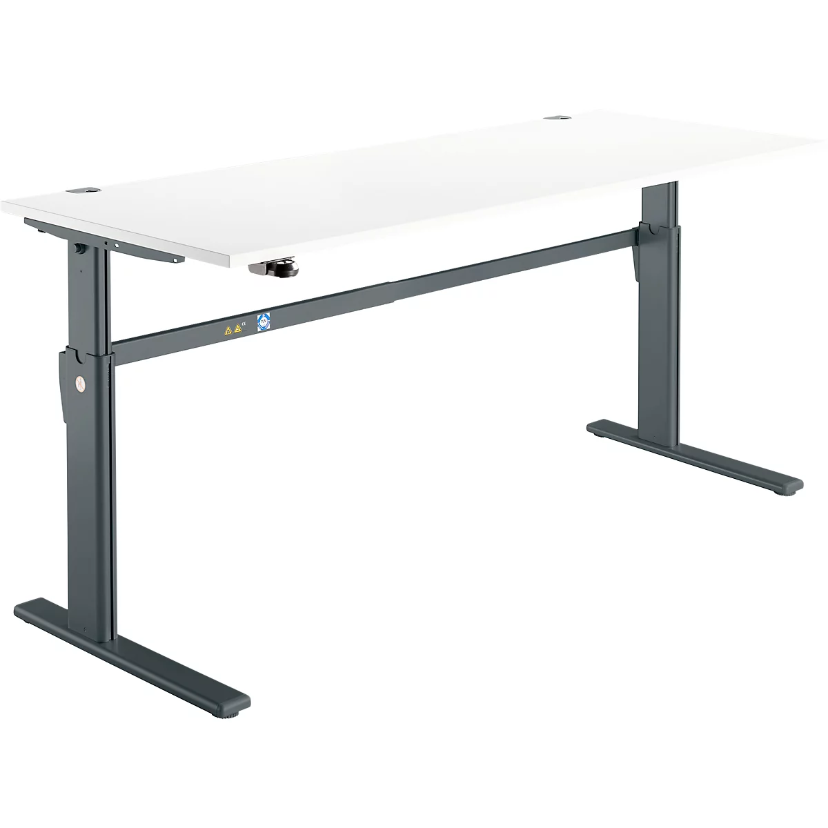 An adjustable height desk. The light-colored tabletop is supported by a dark-colored frame.