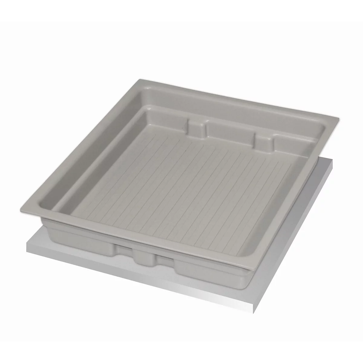 Gray plastic tray with a ribbed surface. It rests on a white base.