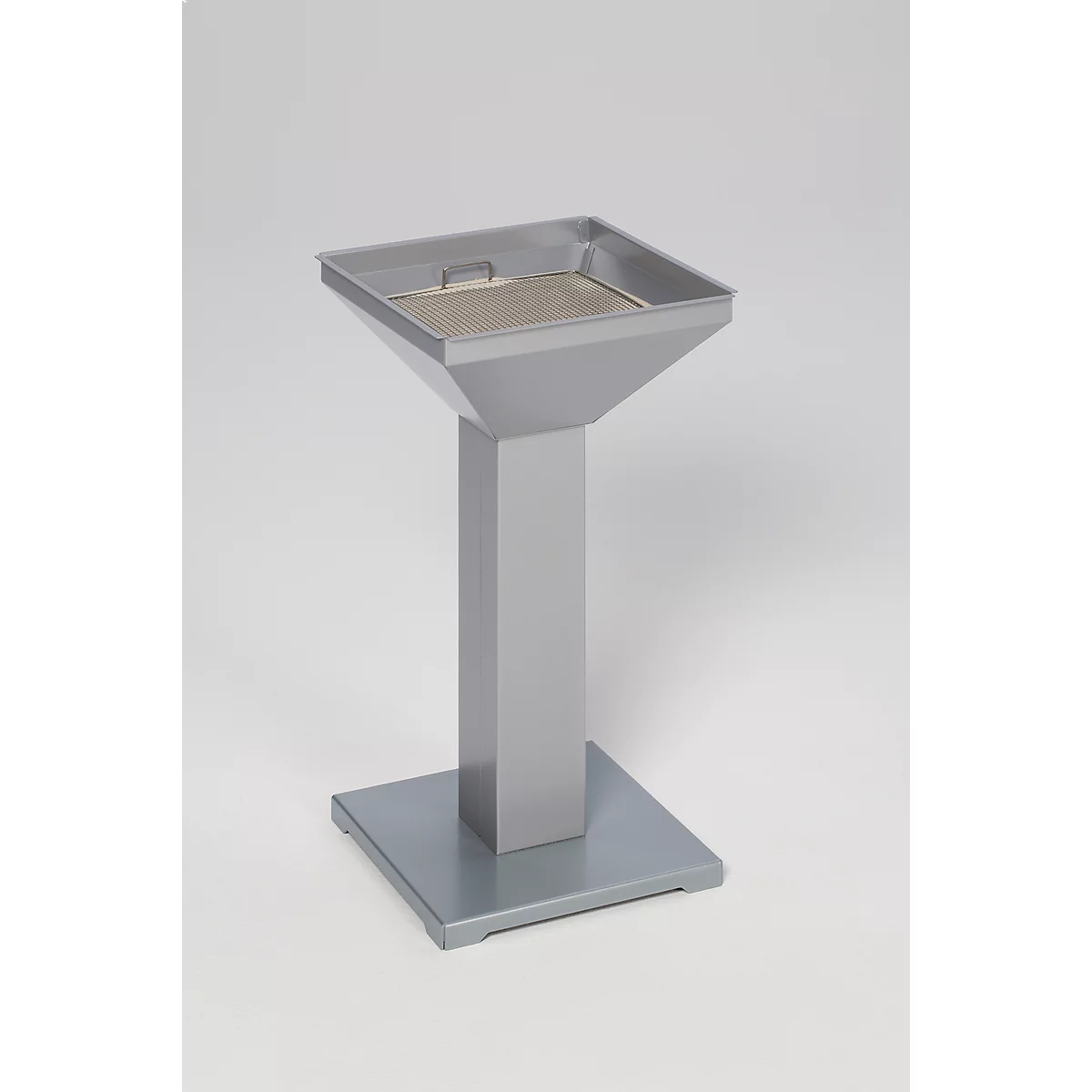 Gray metal urn on square base. Top bowl is square with a handle.