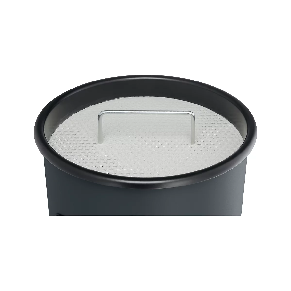 Close-up of a round container with a white filter insert and silver handle.