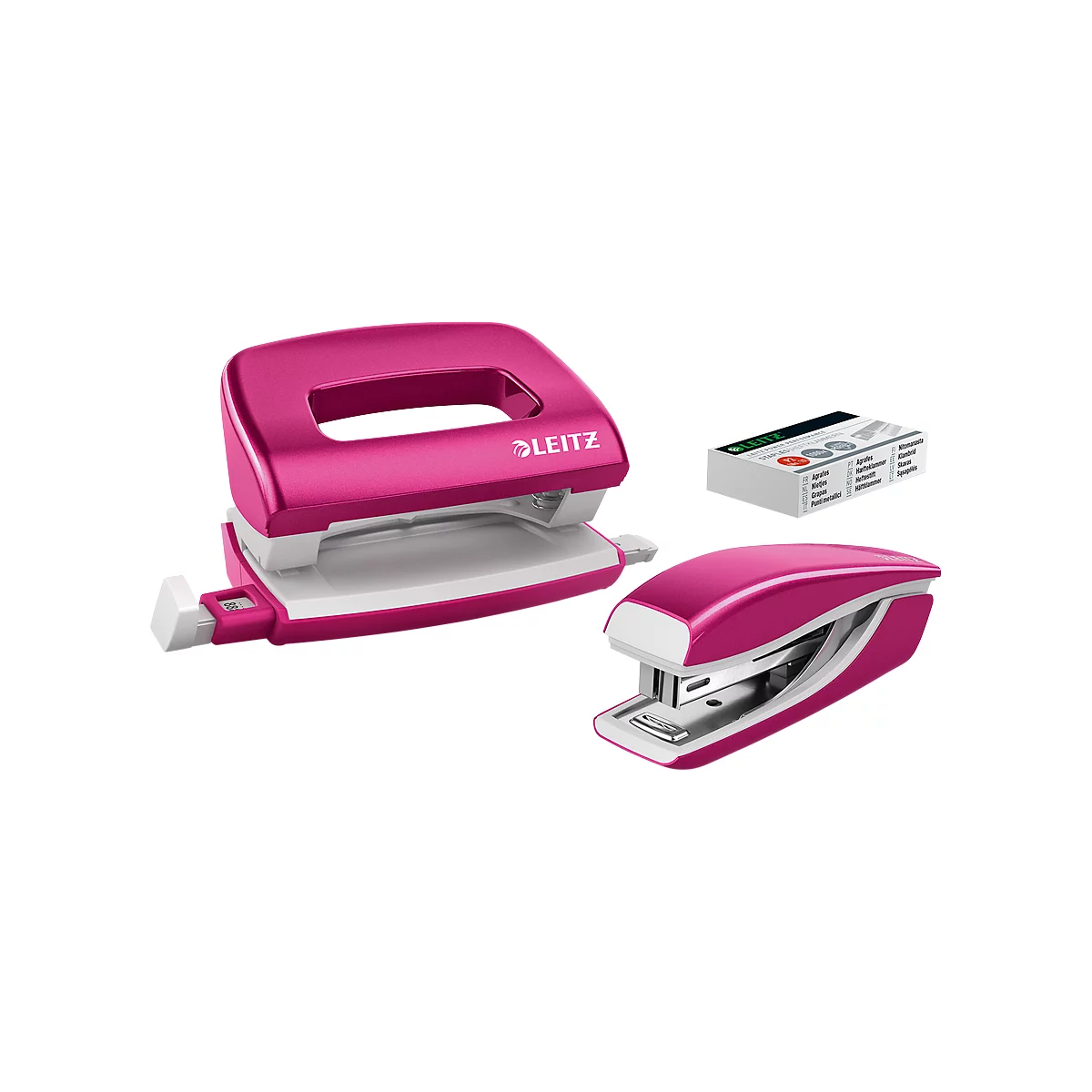 Pink hole punch, stapler, and staple box. The hole punch has the text "LEITZ".