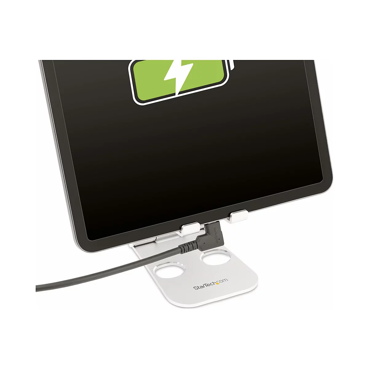 Ein Tablet mit Ladesymbol auf einem Ständer, Kabel verbunden.