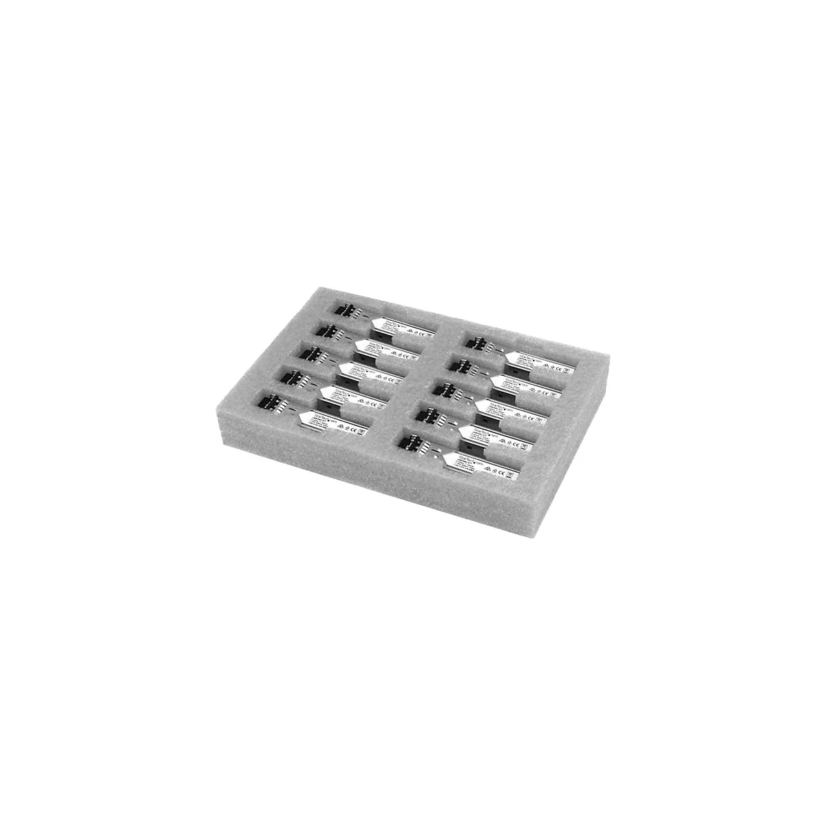 Photo en niveaux de gris de composants électroniques dans un insert en mousse, étiquetés avec du texte.