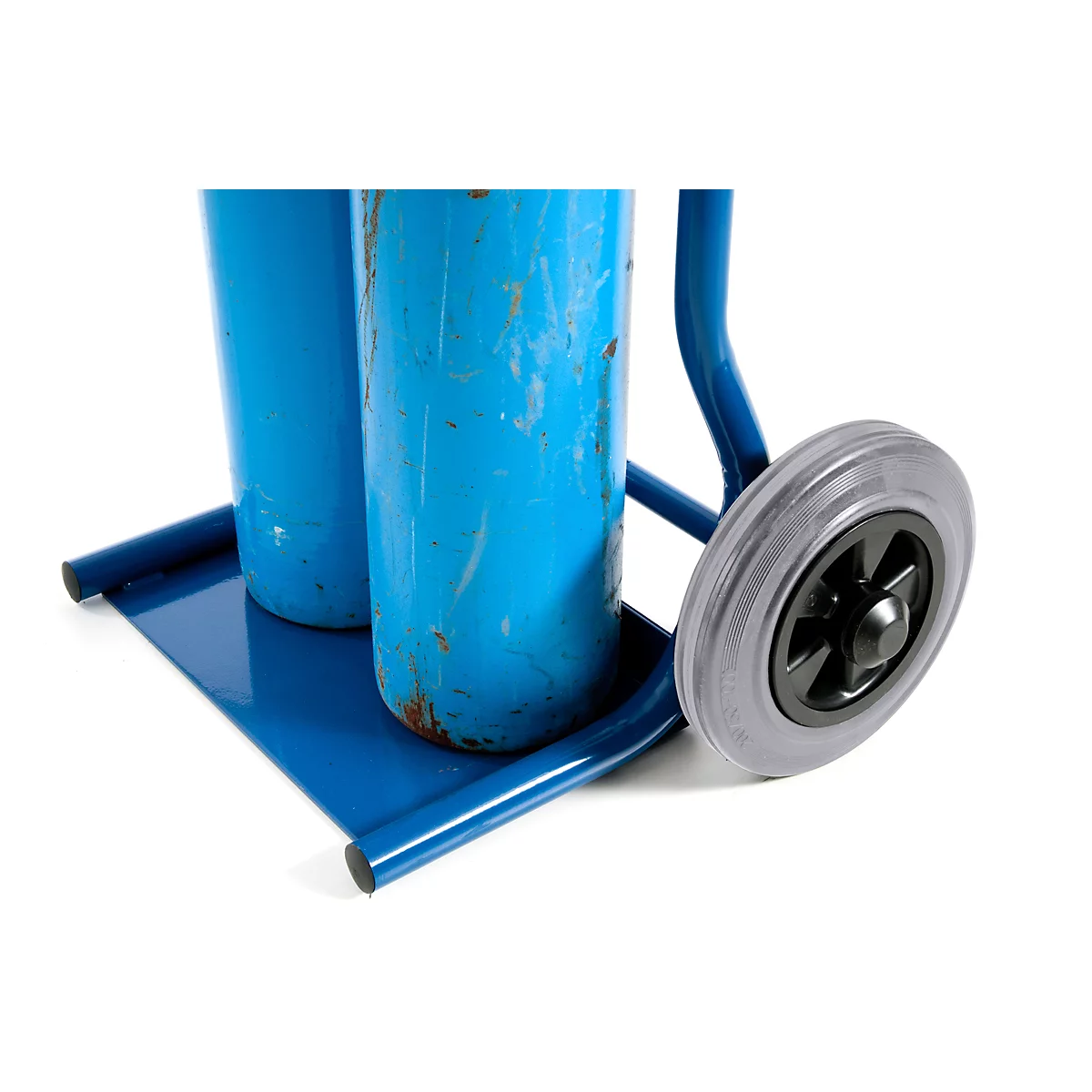 Blue painted transport trolley with two gas cylinders. One wheel is partially visible.