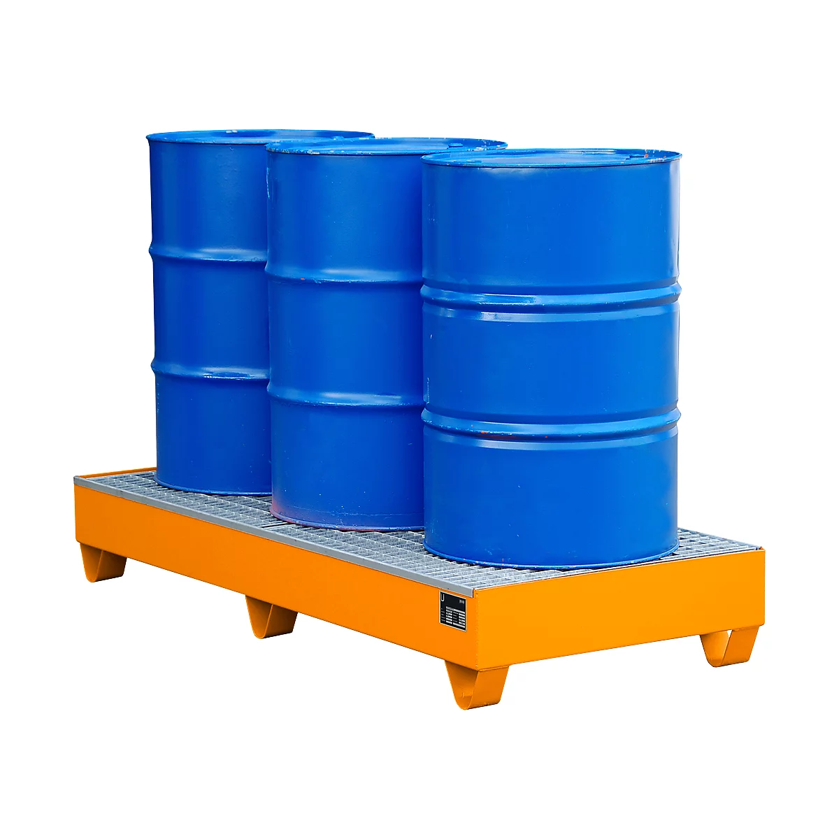 Three blue barrels stand on an orange spill containment.